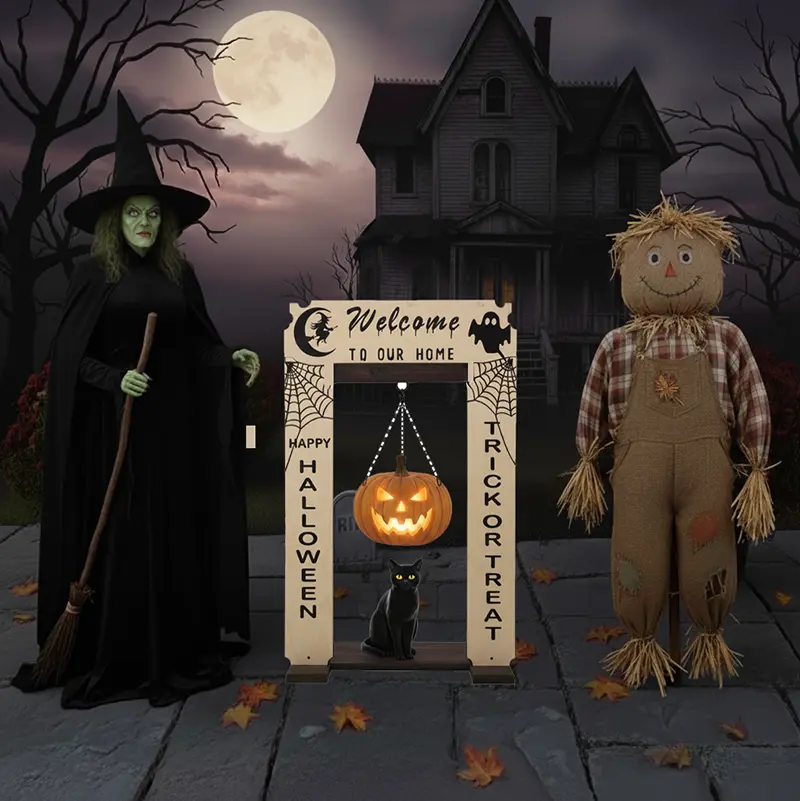 StandCraft Canada display stand decorated for Halloween featuring a 'Welcome' sign, spooky themes, hanging jack-o'-lantern, and black cat, shown in a scene with a witch and scarecrow.